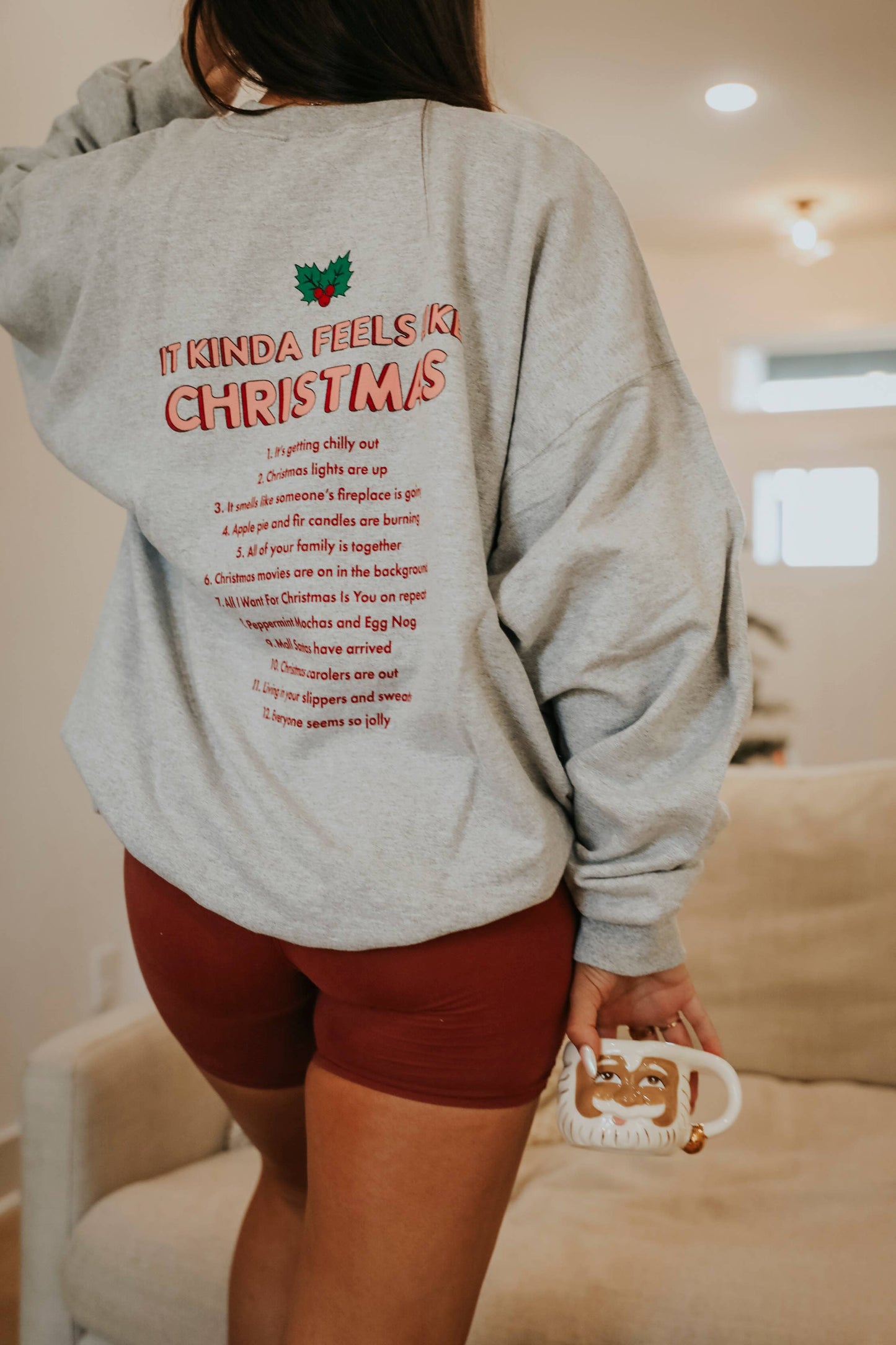 Kinda Feels Like Christmas Sweatshirt - Front & Back graphic